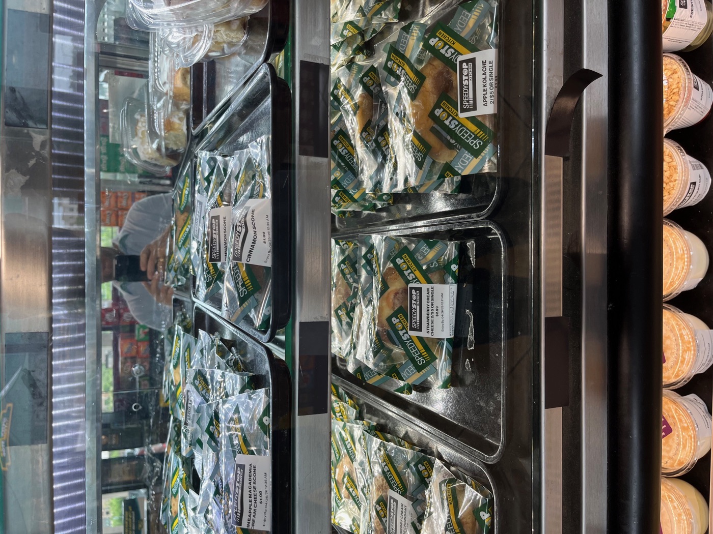 Bakery case with wrapped pastries at SpeedyStop Kitchen